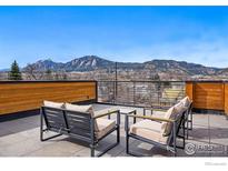 Relax on this outdoor deck with mountain views and patio seating at 1916 23Rd St, Boulder, CO 80302