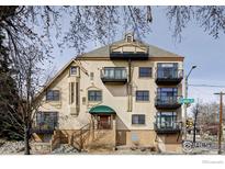 Charming exterior view featuring multiple balconies and unique architectural details at 3299 Lowell Blvd # 103, Denver, CO 80211