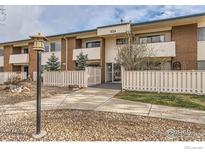 Charming two-story townhome featuring brick accents, white fencing and private entryway at 5126 Williams Fork Trl # 206, Boulder, CO 80301