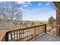 Inviting wooden deck showing off sweeping landscape views at 148 S Holman Way, Golden, CO 80401