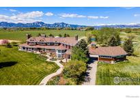 Expansive estate with manicured lawn and mountain views creates a picturesque and luxurious living environment at 2300 N 75Th St, Boulder, CO 80301