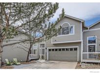 Charming townhome featuring a two-car garage, tree-lined entry, and a private front patio at 3228 47Th St, Boulder, CO 80301