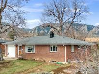 Charming brick home with a well-maintained lawn and mountain views at 345 S 42Nd St, Boulder, CO 80305