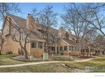 Inviting multi-level townhome with well-maintained landscaping and mature trees at 4799 White Rock Cir # D, Boulder, CO 80301