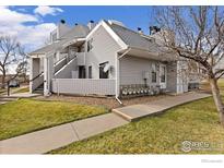 Charming condo complex with well-maintained landscaping and inviting front walkways at 8701 Huron St # 106, Thornton, CO 80260