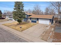 Charming single-Gathering home with a two-car garage and a mature tree in the front yard at 12901 E Idaho Dr, Aurora, CO 80012