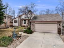 Charming single-Gathering home featuring a two-car garage, mature trees and landscaping at 5665 Cascade Pl, Boulder, CO 80303