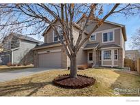 Charming two-story home featuring well-maintained landscaping, a two-car garage, and inviting curb appeal at 6280 Snowberry Ave, Firestone, CO 80504