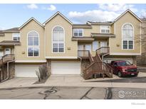 Charming townhome with private garage, deck and steps to entry and beautiful architectural windows at 1747 High Plains Ct, Superior, CO 80027