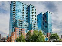 Modern high-rise condo building with balconies and city views and beautiful landscaping at 1700 Bassett St # 1013, Denver, CO 80202
