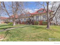 Charming exterior view of building with well-maintained lawn and mature trees at 3250 Oneal Cir # 23, Boulder, CO 80301
