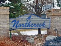 A welcoming Northcreek community entrance with a blue sign and brick pillars gives a warm, neighborhood feel at 3349 Sentinel Dr, Boulder, CO 80301