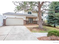 Charming two-story home with a brick-accented front and a well-maintained lawn at 3762 W 99Th Ave, Westminster, CO 80031