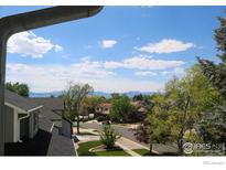 Beautiful neighborhood view from above with blue skies and mountain views at 3762 W 99Th Ave, Westminster, CO 80031