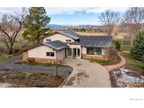 Charming home with stone accents, a well-maintained driveway, and mature trees at 4505 Carter Trl, Boulder, CO 80301
