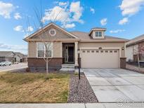 Charming single-Gathering home with a well-manicured lawn, attached two-car garage, and inviting entryway at 15788 Xanthia Way, Thornton, CO 80602