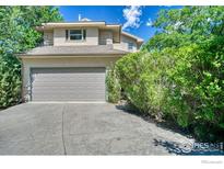 Attractive two-story home with a two-car garage and mature landscaping at 2875 Island Dr, Boulder, CO 80301
