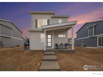 Charming two-story home featuring modern design, inviting porch and low maintenance landscaping at 317 Pyramid Peak St, Berthoud, CO 80513