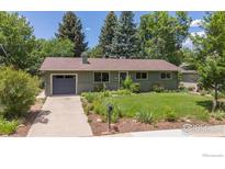 Charming single-story home featuring a well-maintained front yard with mature trees at 3545 Cloverleaf Dr, Boulder, CO 80304