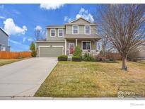 Charming two-story home with a well-maintained front yard and inviting curb appeal at 6297 Clayton Cir, Frederick, CO 80530