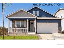 Charming single-Gathering home featuring a covered porch, two-car garage, and craftsman-style details at 4203 Sandstone Dr, Mead, CO 80504