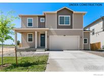 Two-story home featuring neutral siding, a two-car garage and a well-manicured front lawn at 4312 Gypsum Ave, Mead, CO 80504