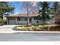 Charming ranch-style home with mature landscaping and a one-car garage at 884 Ithaca Dr, Boulder, CO 80305