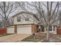 Charming two-story home featuring a two-car garage, brick accents, and well-maintained landscaping at 4185 Corriente Pl, Boulder, CO 80301