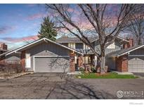 Charming home with a well-maintained exterior, two-car garage, and professionally landscaped yard at 4940 Carter Ct, Boulder, CO 80301