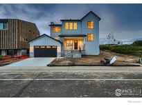 New construction two-story home boasting modern farmhouse charm, gray siding and dark trim, plus a spacious two car garage at 935 Eldorado Ln # A, Louisville, CO 80027
