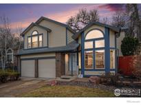 Charming two-story home with a well-maintained front yard and attached two-car garage, perfect for suburban living at 11270 W 66Th Pl, Arvada, CO 80004