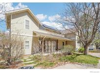 Charming two-story home featuring a welcoming front porch and well-maintained landscaping at 2607 Thornbird Pl, Boulder, CO 80304