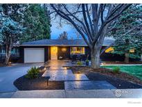 Charming ranch home featuring a brick exterior, inviting patio, and manicured landscaping at 3282 4Th St, Boulder, CO 80304