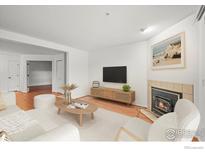 Bright living room with a fireplace, hardwood floors, and stylish decor at 4945 Twin Lakes Rd # 39, Boulder, CO 80301