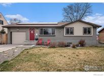 Charming single-story home with a red front door, complemented by solar panels and a well-maintained yard at 9331 Irving St, Westminster, CO 80031