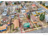 Aerial view of a residential lot surrounded by other homes, showcasing the neighborhood and outdoor space at 930 Parkview St, Louisville, CO 80027