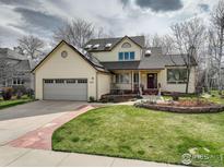 Charming two-story home with a well-maintained lawn and a two car garage at 4462 Wellington Rd, Boulder, CO 80301