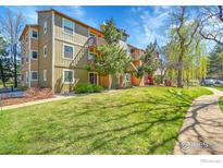 Multi-Gathering home featuring lush green lawns, mature trees and charming balconies perfect for outdoor living at 2867 Sundown Ln # 106, Boulder, CO 80303