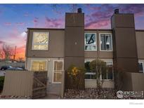 A charming two-story townhome with a private entrance and meticulously maintained landscaping at 7373 W Florida Ave # 2H, Lakewood, CO 80232