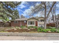 Charming single-Gathering home featuring a brick and stucco exterior with landscaped front yard at 775 Grape Ave, Boulder, CO 80304