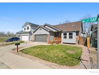 Charming exterior featuring a well-manicured lawn and an inviting entrance at 9215 W 106Th Ave, Broomfield, CO 80021