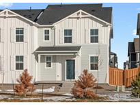 Charming exterior of a two-story home featuring a combination of light gray and white siding at 255 Mayfly Ln, Berthoud, CO 80513