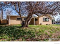Charming brick home featuring a well-maintained lawn and mature tree in a quiet neighborhood at 3205 19Th St, Boulder, CO 80304