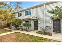 Two-story townhouse featuring a tidy yard and a welcoming front entrance at 3582 Broadway St, Boulder, CO 80304