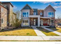 Attractive two-story home with a well-maintained lawn and a mix of stone and siding accents at 3620 Paonia St, Boulder, CO 80301