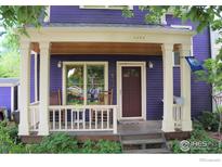 Charming front porch with rocking chairs, painted a lovely shade of purple at 2276 Goss Cir, Boulder, CO 80302