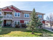 Charming townhome with well-manicured lawn and appealing stone accents at 3488 Molly Cir, Broomfield, CO 80023