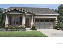 Charming single-Gathering home with stone accents, a two-car garage, and a well-manicured lawn at 3039 Newfound Lake Rd, Berthoud, CO 80513