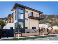Stunning contemporary exterior with clean lines, large windows, and a stylish balcony overlooking the neighborhood at 358 Arapahoe Ave # C, Boulder, CO 80302