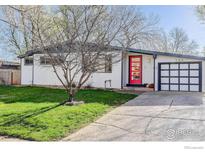 Charming ranch home with a red front door, well-kept lawn, and attached garage at 740 32Nd St, Boulder, CO 80303